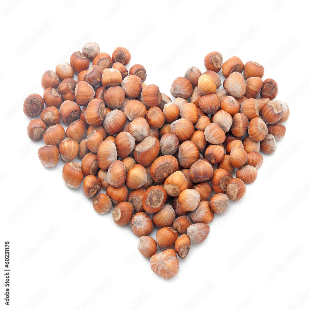 hazelnuts in shape of heart isolated on white hazelnuts in shape of heart isolated on white