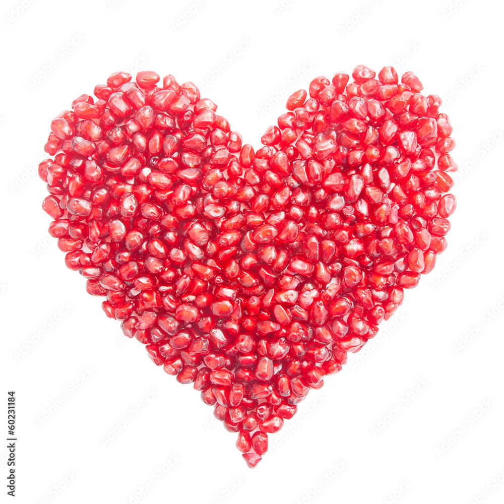 heart-shaped pomegranate seeds isolated on white heart-shaped pomegranate seeds isolated on white