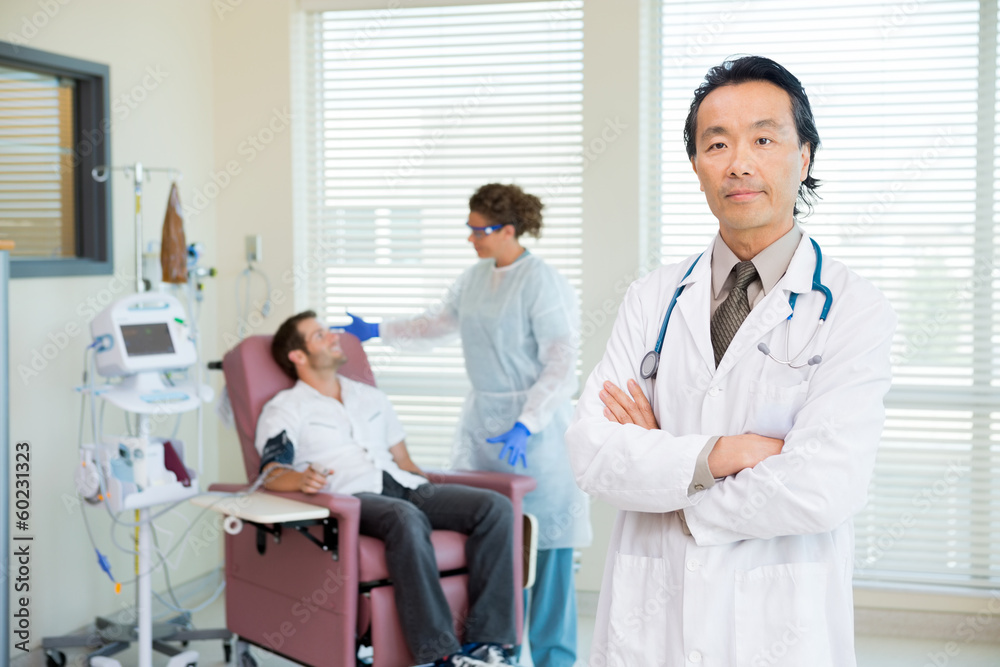 Doctor With Patient Being Examined By Pulse Rate Machine Doctor With Patient Being Examined By Pulse Rate Machine