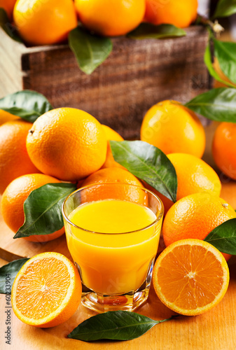 Fototapeta Naklejka Na Ścianę i Meble -  glass of orange juice with fresh fruits