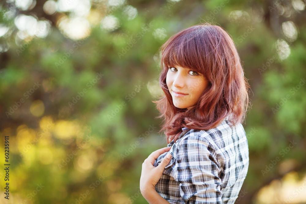 Portrait of a beautiful young woman in summer park Portrait of a beautiful young woman in summer park