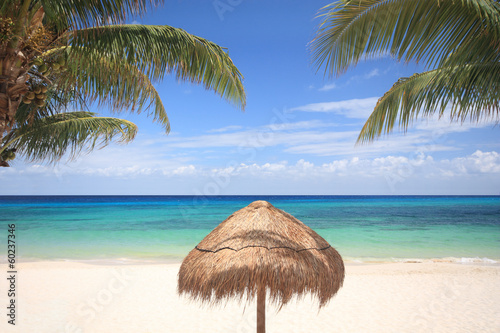 Grass umbrella on tropical beach