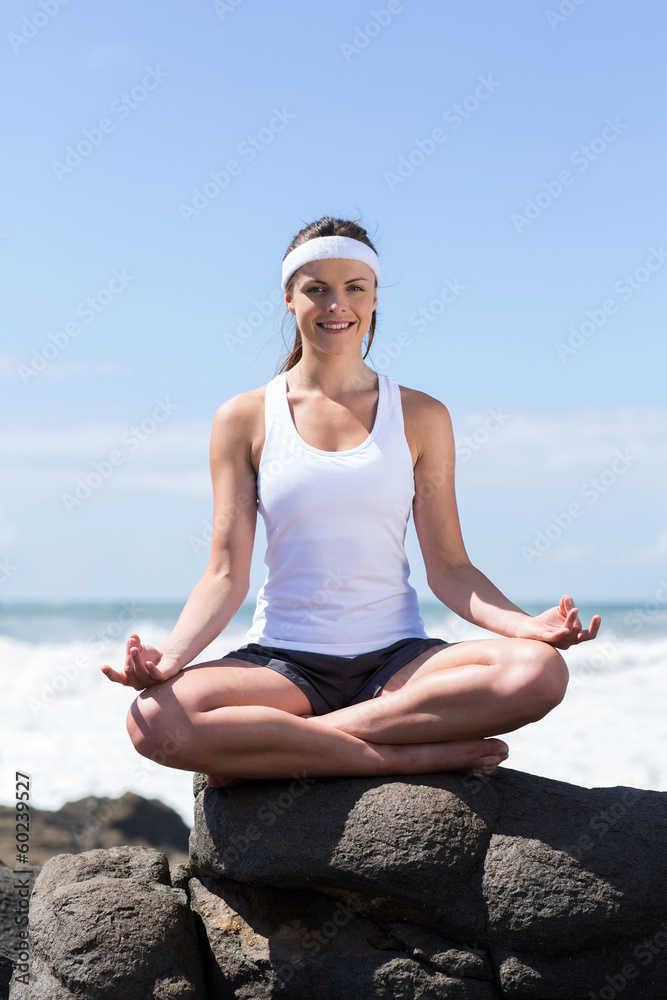 smiling woman doing yoga pose