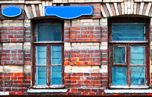Grunge brick facade with windows