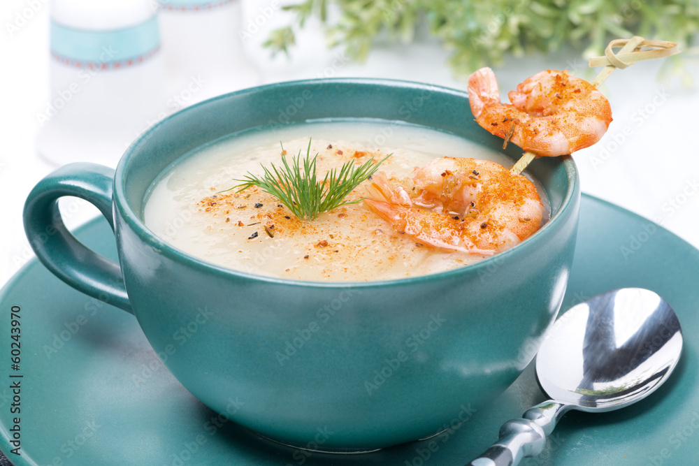 potato cream soup with shrimps on a skewer, close-up potato cream soup with shrimps on a skewer, close-up