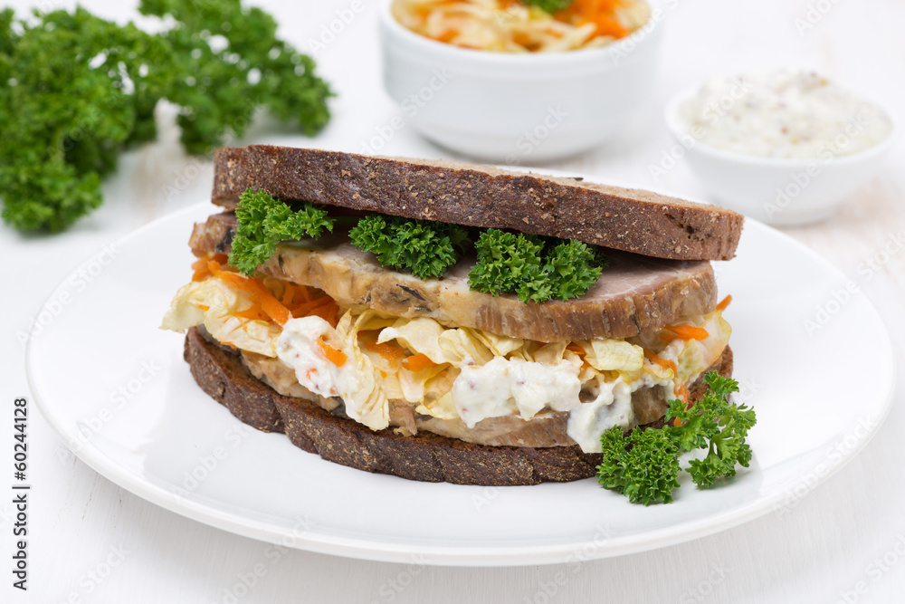 sandwich of rye bread with coleslaw and baked meat sandwich of rye bread with coleslaw and baked meat