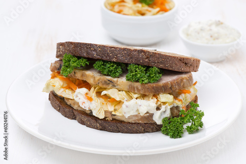 sandwich with coleslaw and baked meat, horizontal photo