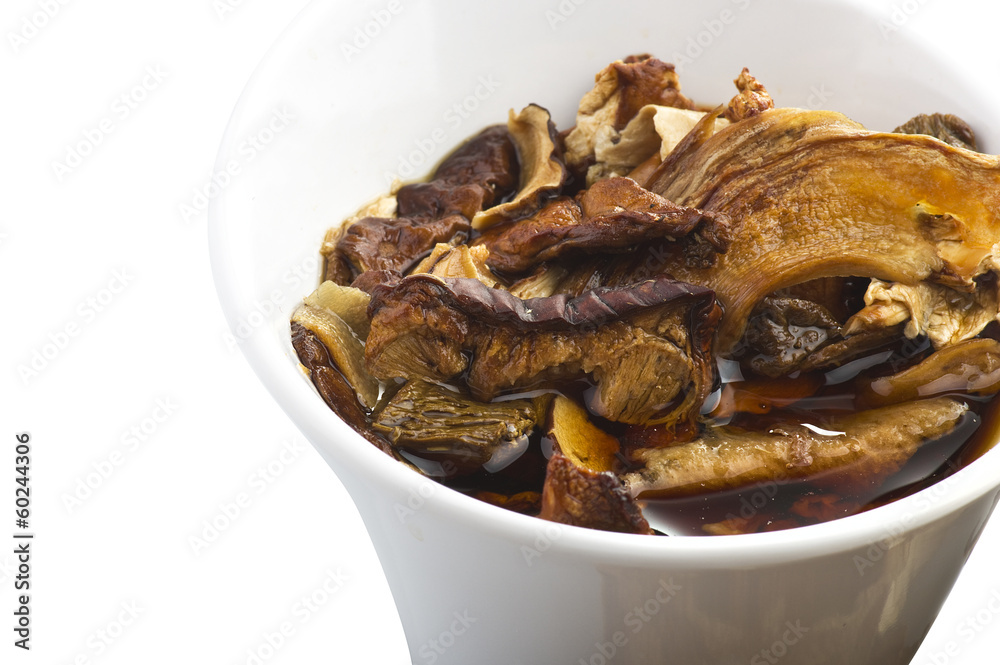 cinnamon sticks and dried porcini mushrooms in jar cinnamon sticks and dried porcini mushrooms in jar