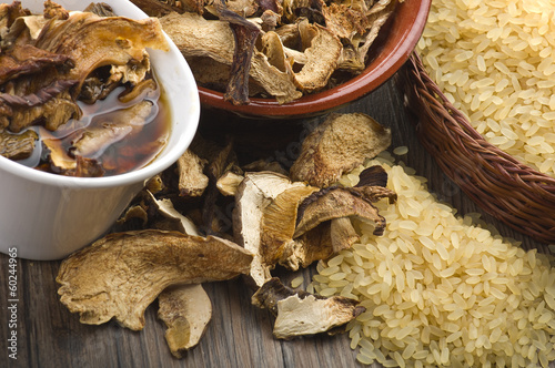 Rice and dried porcini mushrooms on table