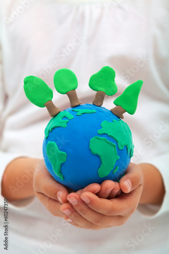 Fototapeta Naklejka Na Ścianę i Meble -  Ecology and environment concept with trees on clay world