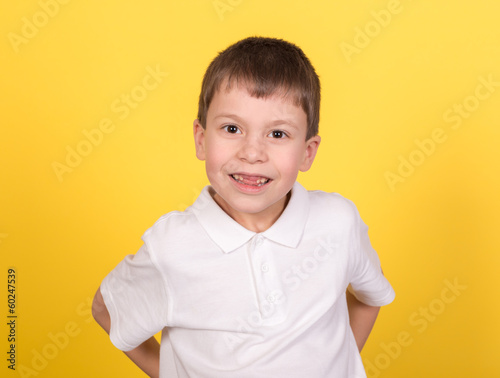 boy portrait in white shirt on yellow