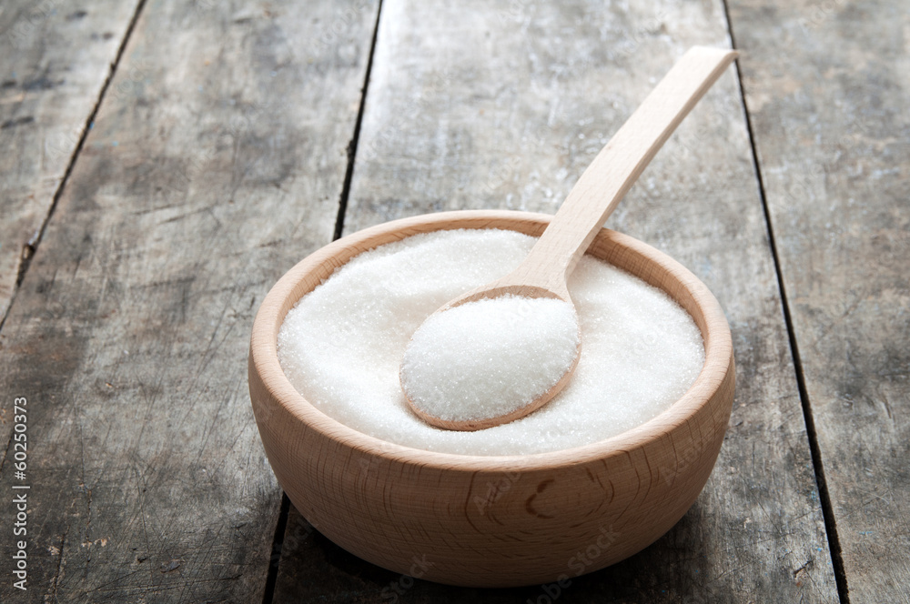 sugar in a wooden bowl sugar in a wooden bowl