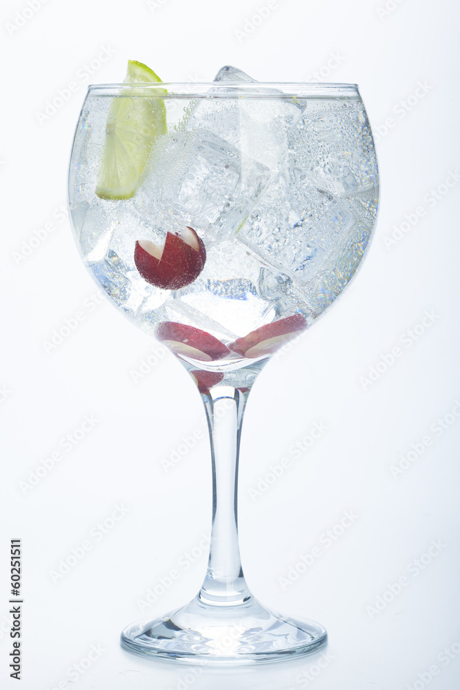 grape and lime gin tonic isolated over white grape and lime gin tonic isolated over white