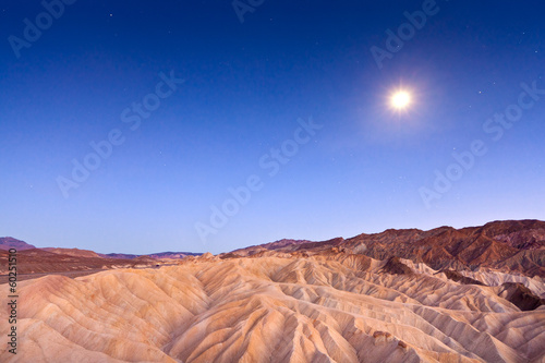 Desert sunset and moonlight