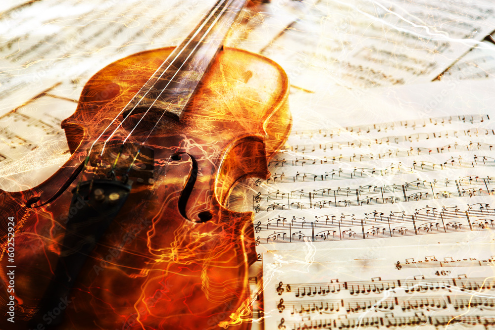 Fototapeta premium Stare skrzypce leżące na kartce muzyki