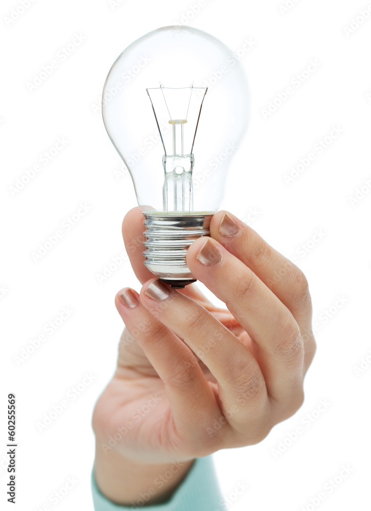 close up of woman hand holding light bulb close up of woman hand holding light bulb