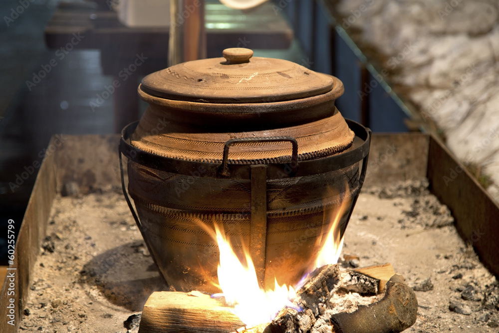 Clay pot over fire Clay pot over fire