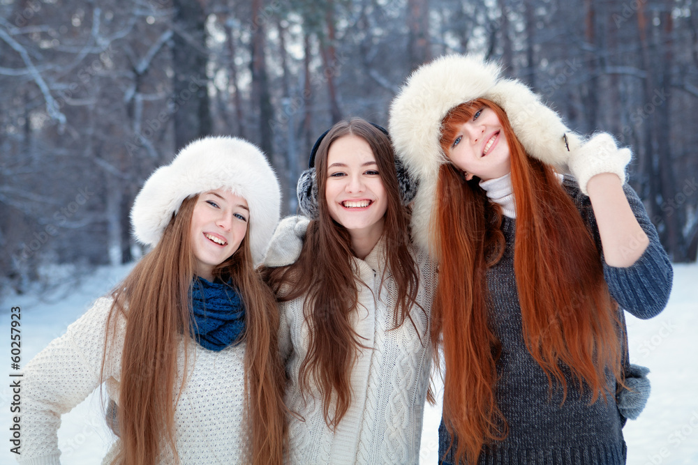 Portrait of three beautiful girls in winter park Portrait of three beautiful girls in winter park