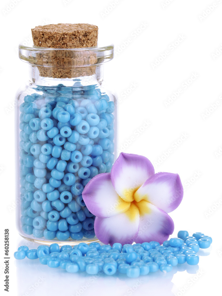 Little bottle full with colorful beads isolated on white Little bottle full with colorful beads isolated on white