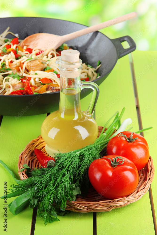 Noodles with vegetables on wok on nature background background Noodles with vegetables on wok on nature background background