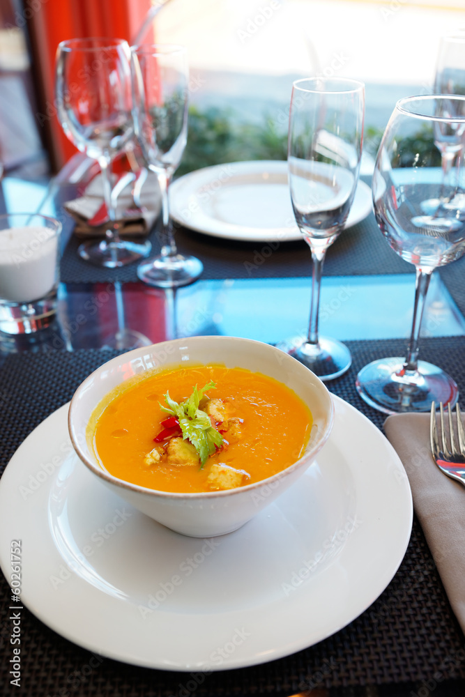 Pumpkin soup on restaurant table Pumpkin soup on restaurant table