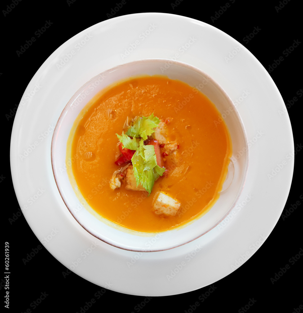 Pumpkin soup in plate shot from above, isolated Pumpkin soup in plate shot from above, isolated