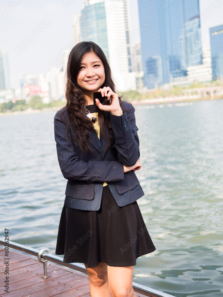 Fototapeta premium Portrait of a woman using a cell phone