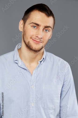 Handsome young man in a blue shirt
