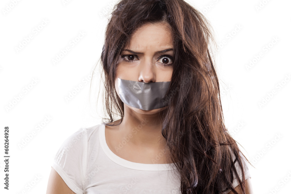 upset girl with selfadhesive tape over her mouth StockFoto Adobe Stock