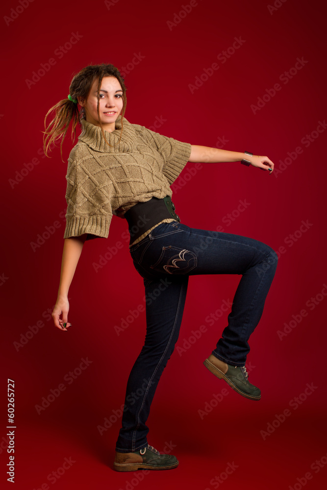 woman with dreadlocks on a red background