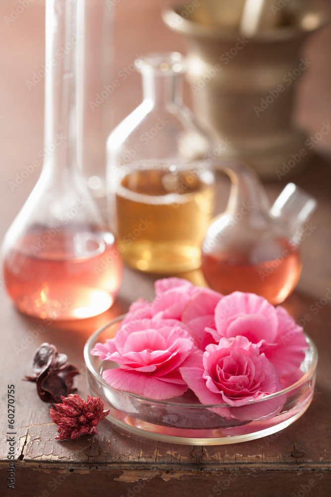 aromatherapy and alchemy with pink flowers
