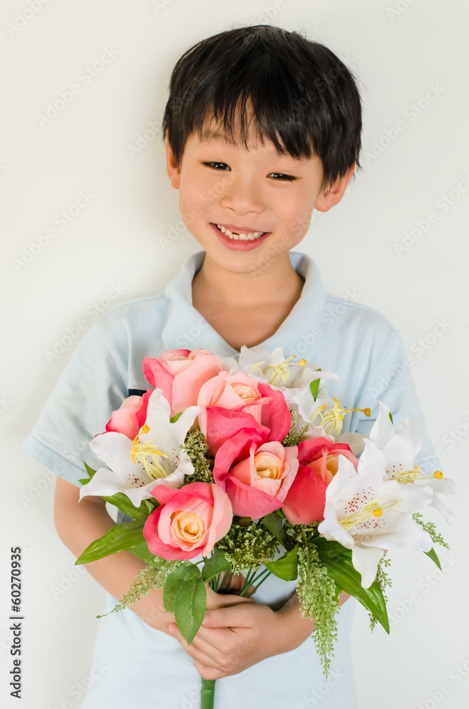 Asian boy holding flower bouquet on white background Asian boy holding flower bouquet on white background
