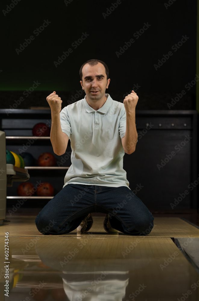 Ecstatic Bowling Men With Raised Hands