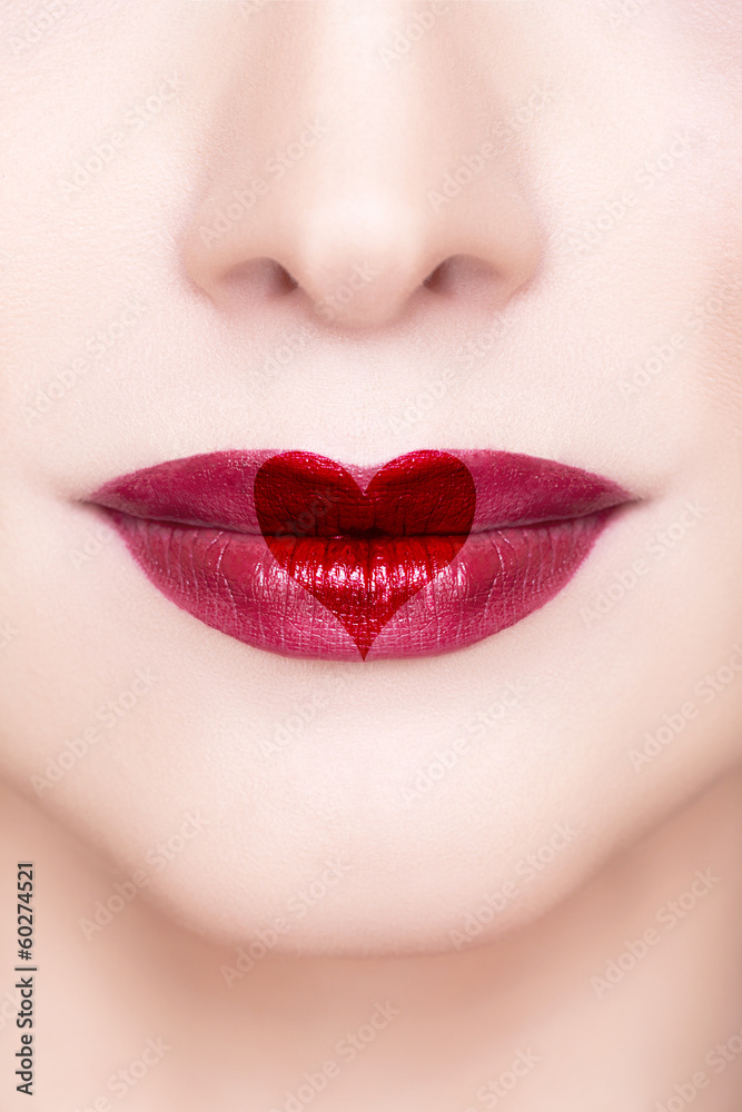 Fototapeta premium Red lips with heart shape