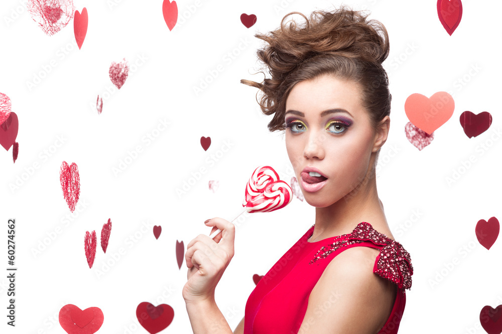 brunette woman holding lollipop brunette woman holding lollipop