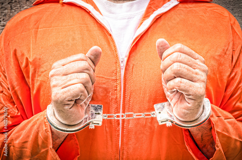Photos Handcuffed Hands - Guantanamo prison orange clothes