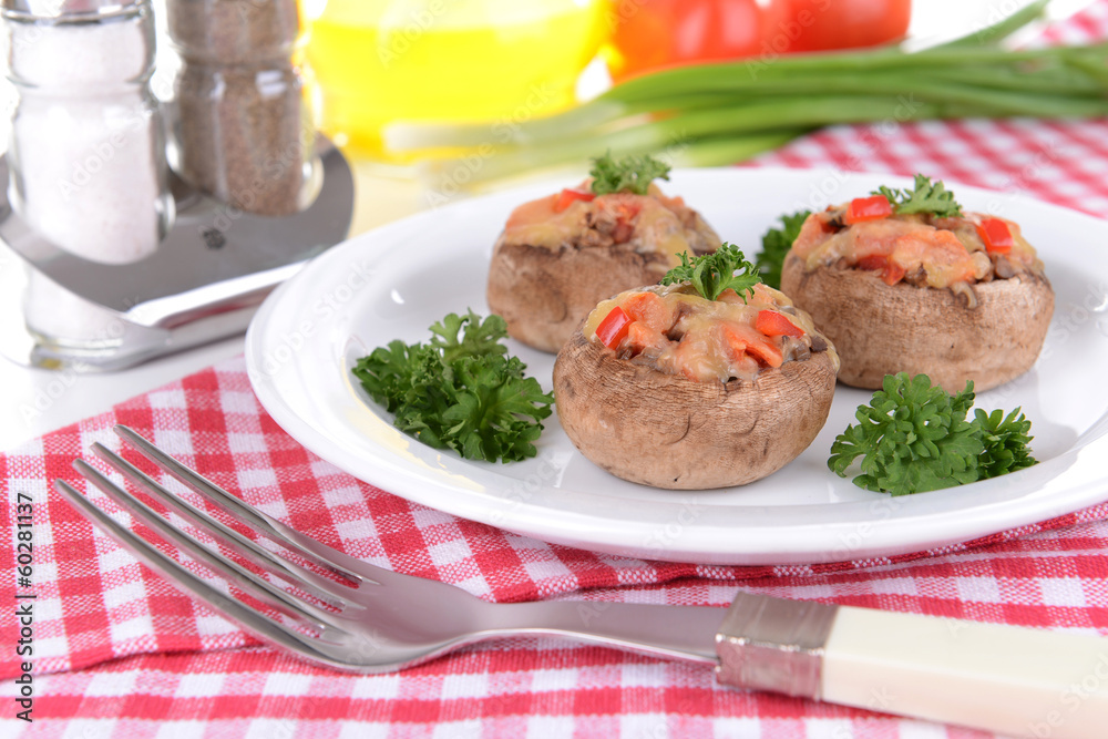 Stuffed mushrooms on plate on table close-up Stuffed mushrooms on plate on table close-up