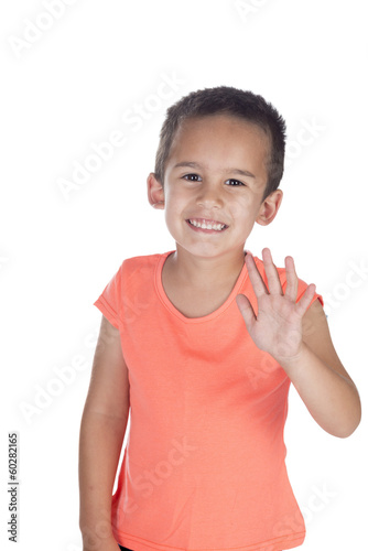 little boy with orange shirt waving