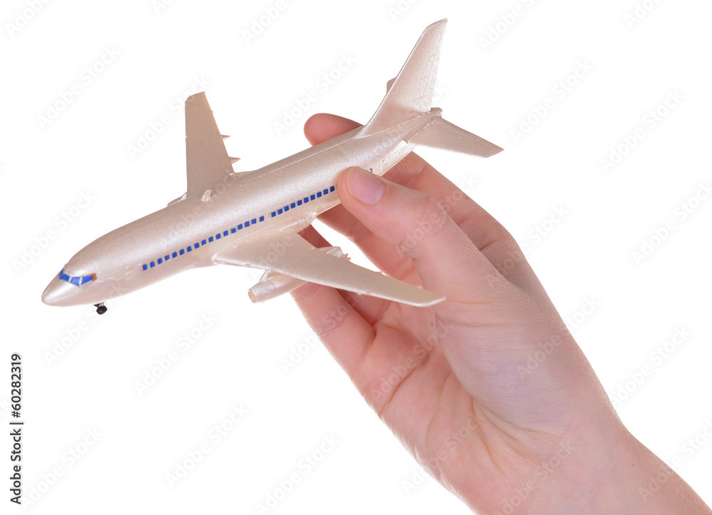 Toy airplane in hand isolated on white Toy airplane in hand isolated on white