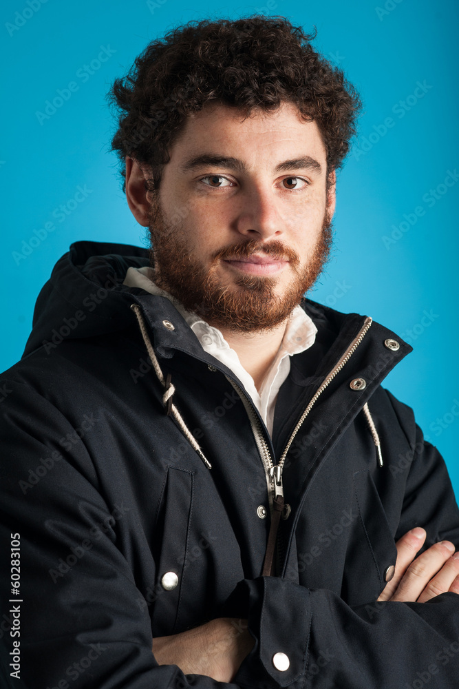 Close up portrait of confident young man wearing winter jacket a Close up portrait of confident young man wearing winter jacket a