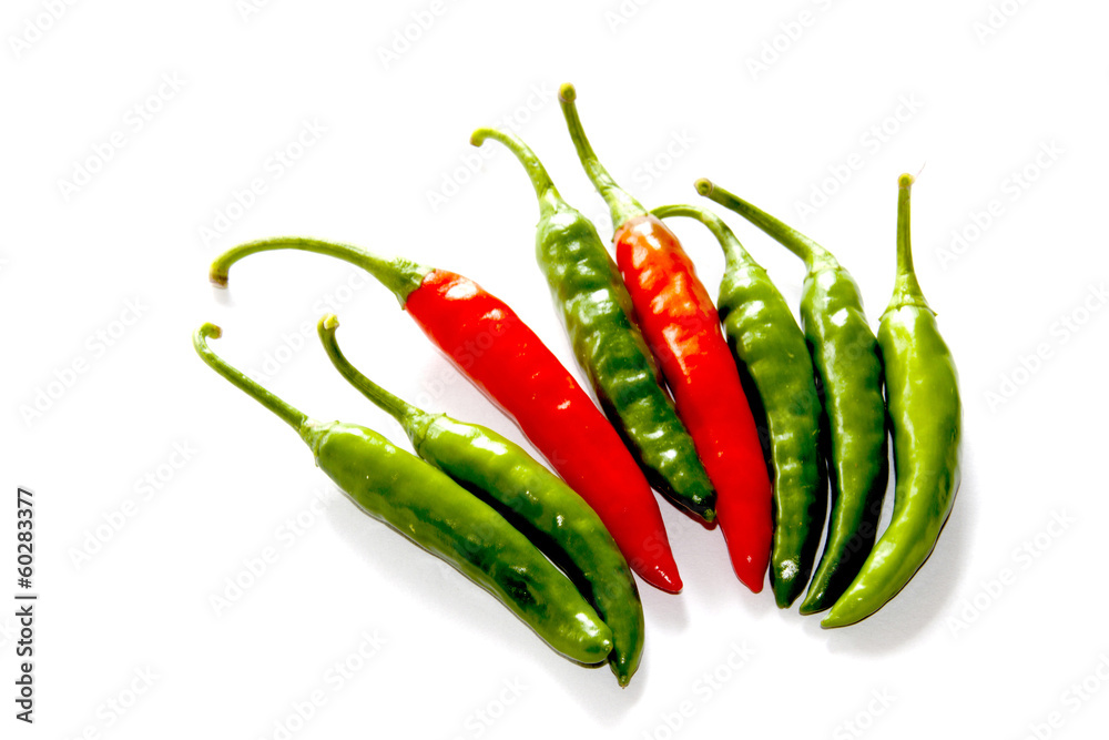 Isolated Arrangement Of Two Red And Six Green Chillies