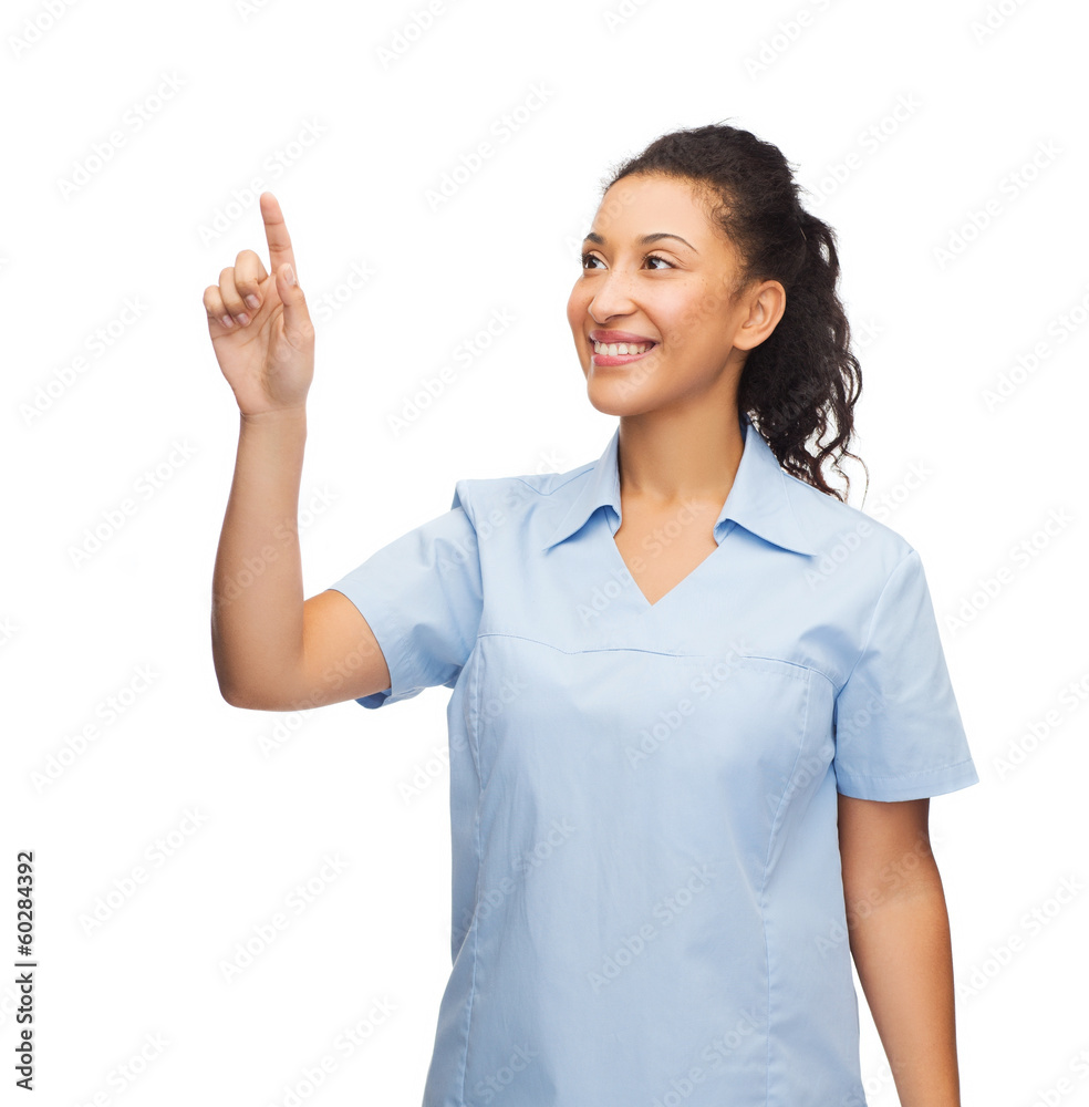 smiling doctor or nurse pointing to something smiling doctor or nurse pointing to something