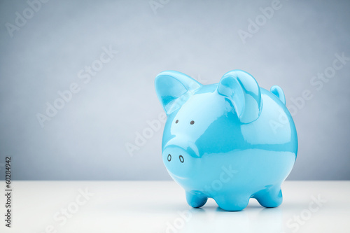 Blue Piggy Bank on a Table