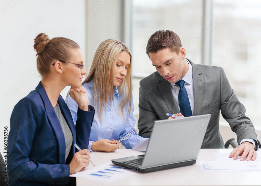 business team with laptop having discussion business team with laptop having discussion