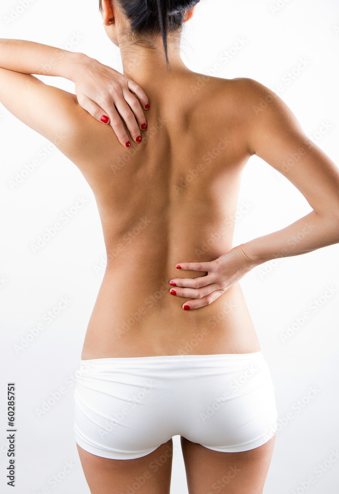 Young Woman With Pain In Her Back