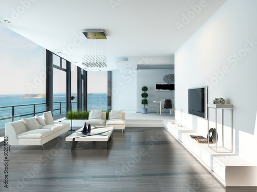 Luxury living room interior with white couch and seascape view