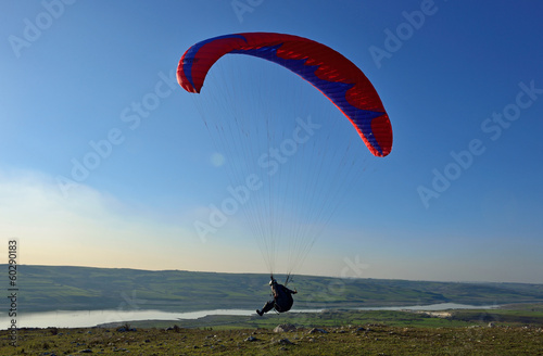 Paraglider taking off from a mountain