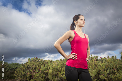Serious female jogger outdoors looking confident, ready to start © Tommaso Lizzul