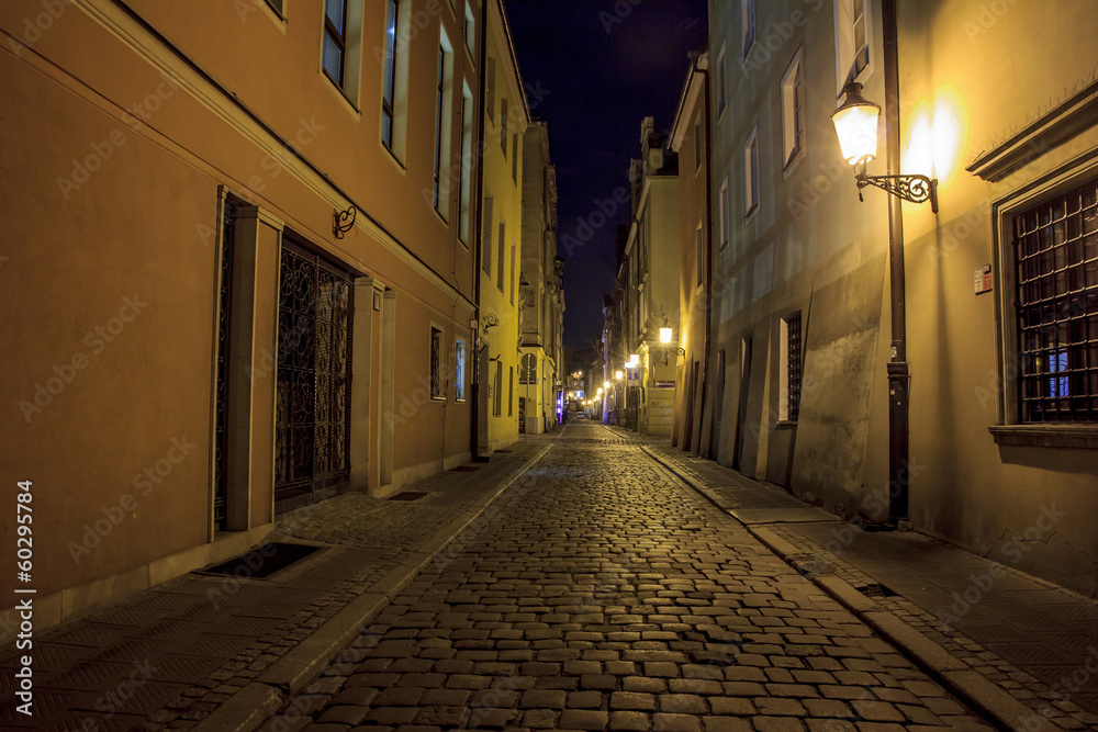Night photo of a cobbled street in the old, historical part of P
