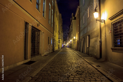Night photo of a cobbled street in the old, historical part of P